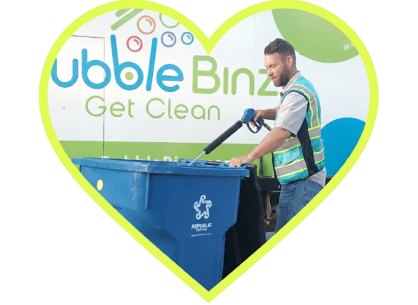 Worker cleaning trash cans