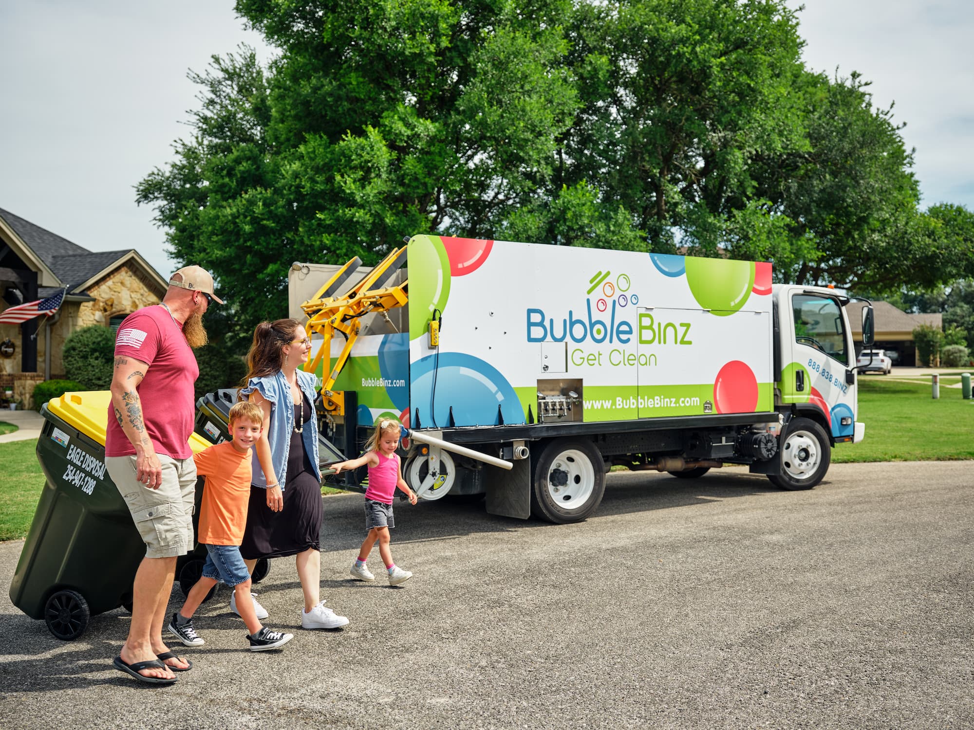 Bubble Binz service truck with happy family